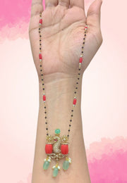 Stunning black beads chain with coral beads and green combination